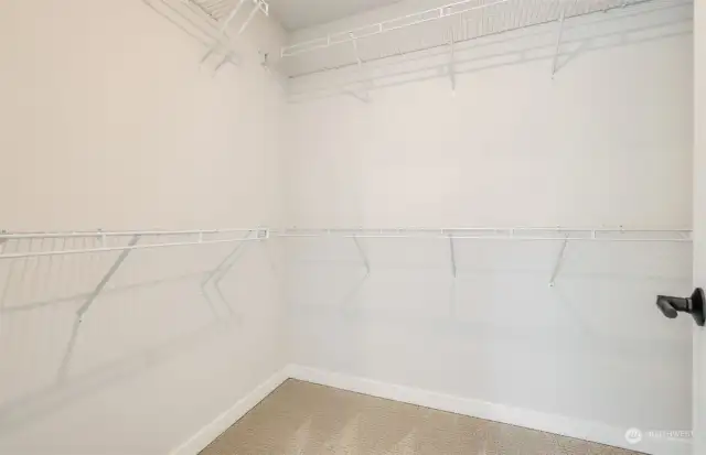 Walk-in primary closet.  All pictures are of a completed home of same plan. Finishes will vary.