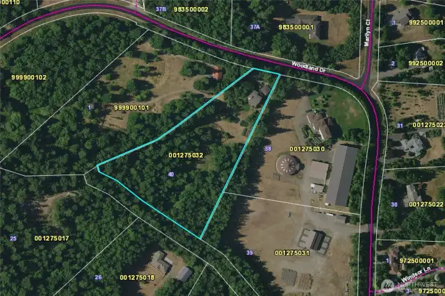 Aerial view of the property. The buildings are at the narrower end.