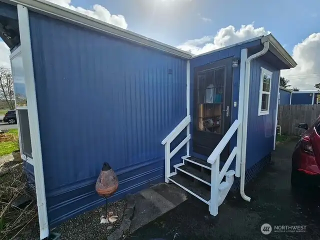 Covered entry on the driveway side.