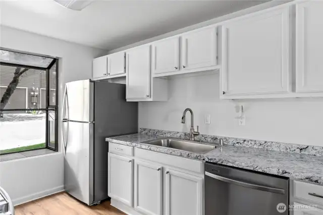 Beautiful updated countertops and sink.