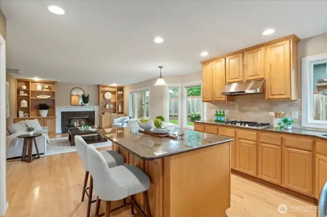 You will love preparing meals and hosting in this kitchen with large island and a natural gas cooktop