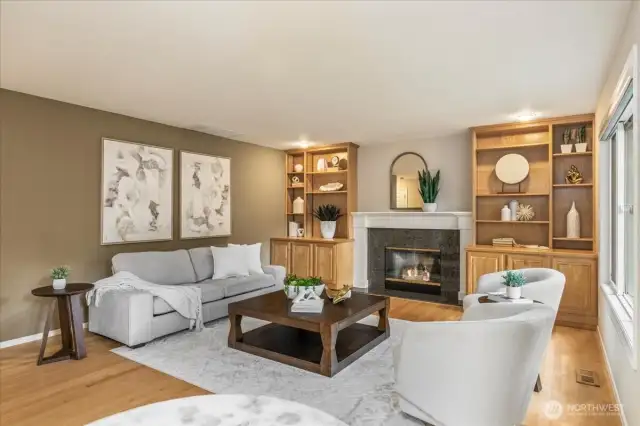 Cozy up to the gas fireplace on a cold evening or relax with a book in front of the wall of windows. The built in cabinets are great for extra storage as well.