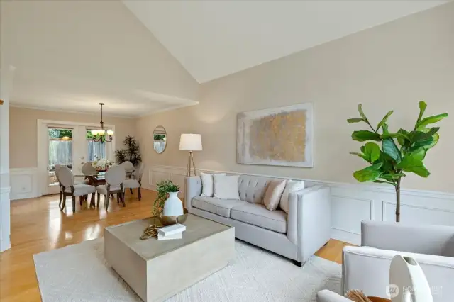 The vaulted living room ceilings and wainscotting add elegance to the space