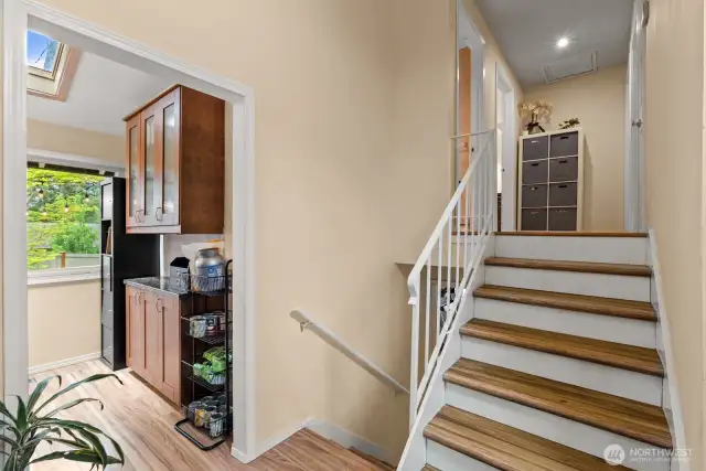 Upstairs to bedrooms, downstairs to bonus room.