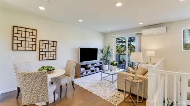 You see the room that can be used as a family or living room.  A large glass sliding door takes you to a spacious deck that is perfect for morning coffee or relax.