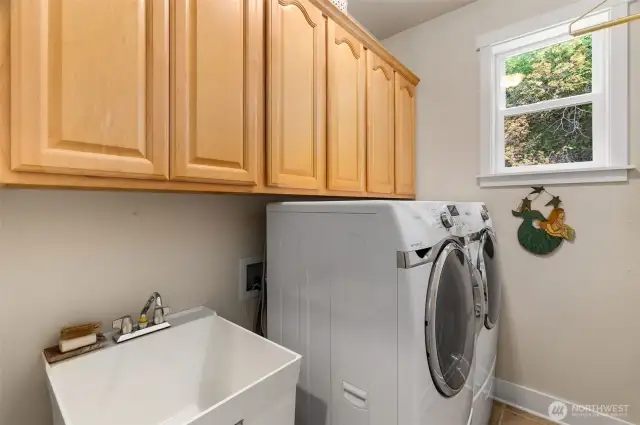 Laundry room with utility sink, lots of cabinet storage