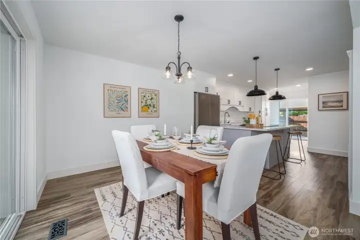 Back inside, the dining room opens into the stunning remodeled kitchen.