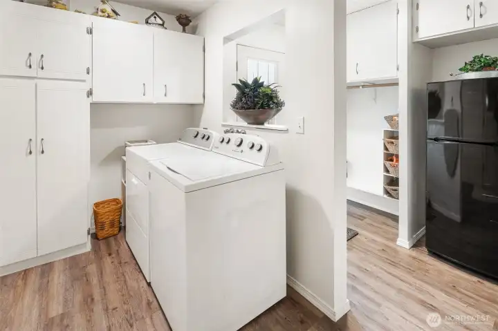 utility room off of garage, and door to backyard- lots of storage!