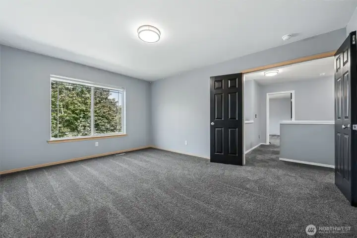 Large bonus room on upper floor with double door entry
