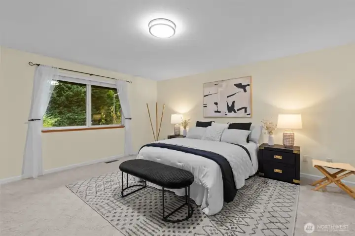 Primary bedroom with views of private back yard