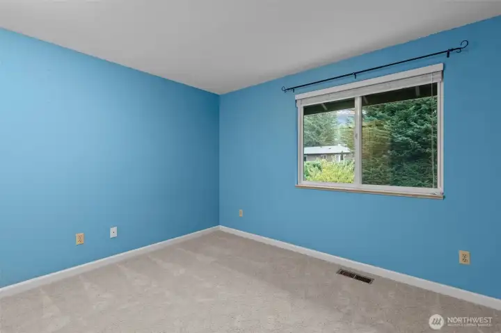 Bedroom 3 with view of backyard