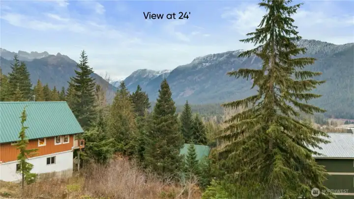At twenty-four feet—your main living level—the landscape becomes panoramic. The valley pulls farther into view, the ridgelines become more defined. This is where great rooms, kitchens, and dining spaces turn into front-row seats for nature’s show.