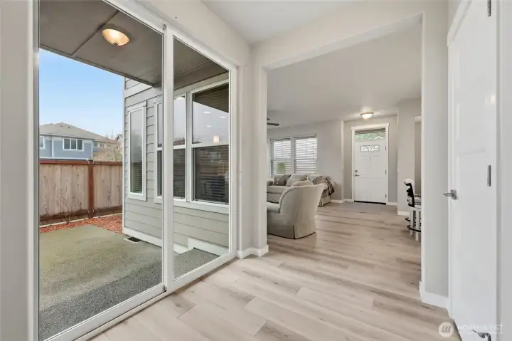 Sliding glass door leads to the semi-covered porch.