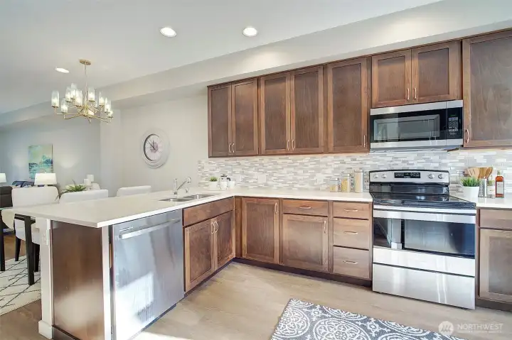 Tons of storage, stainless  appliances and gorgeous quartz countertops!