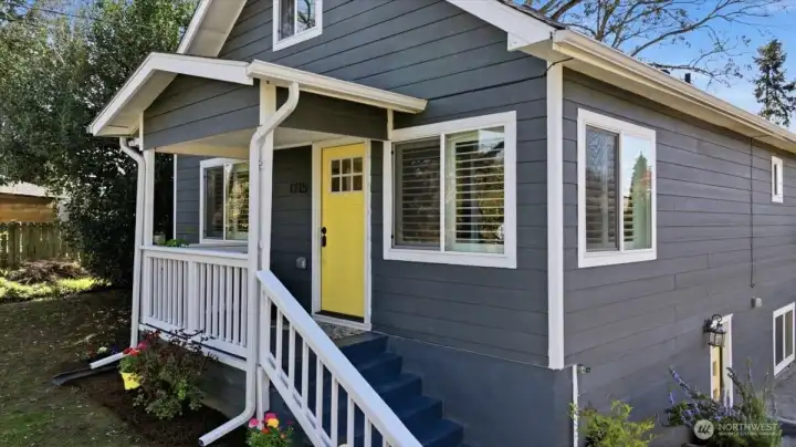 Quaint, covered front porch welcomes you home.  A great place for a bench if desired.  Tree lined sidewalks, on each side of the street, make this a great walk-able neighborhood!