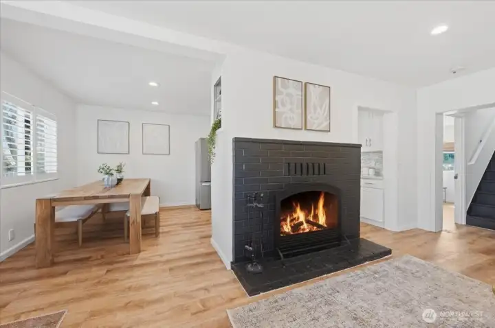Living room flows nicely into dining area/kitchen and back out on other side of fireplace