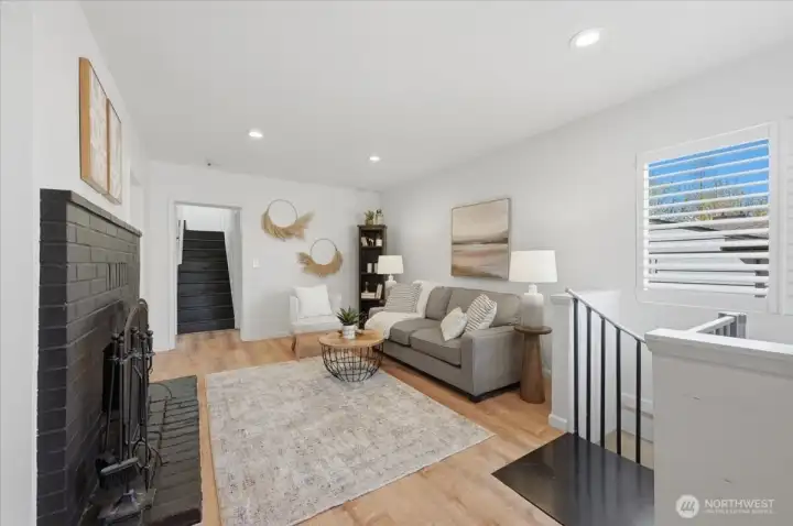 Spiral staircase leading to basement just to the right in this photo.  The Staircase was added for ease to daylight basement, though if long or short term rental is something you desire (buyer to verify), staircase can be removed & closed up to give privacy.  Laundry accessible by both levels from back door creating shared laundry area