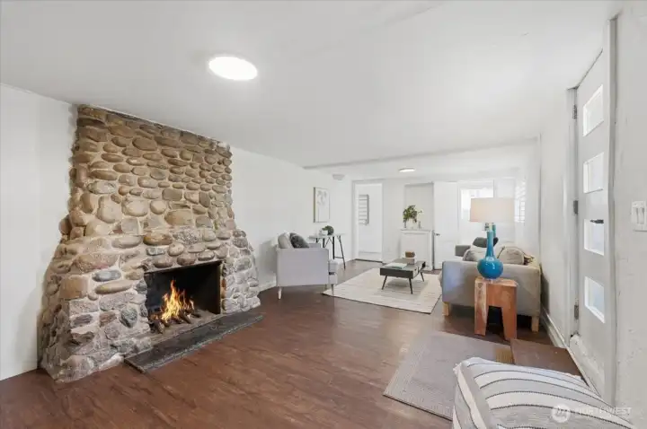 Beautiful, original Stone fireplace is the Show Stopper in this room!  Adds so much character and warmth