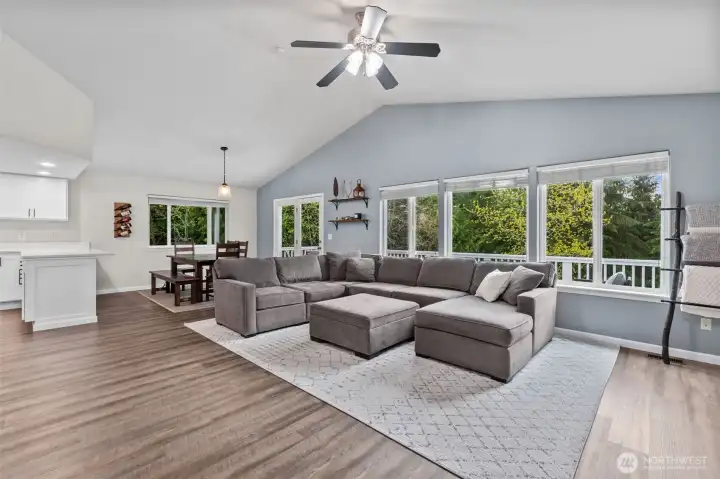 Soaring ceilings and abundant natural light throughout.