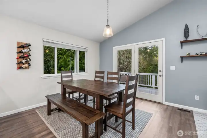 Light-filled dining space overlooking the property.