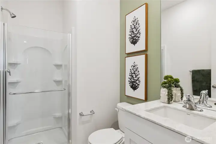 Main floor 3/4 bath perfect for guests. Actual home is under construction and finishes, materials, and colors will vary. See site agent for details.