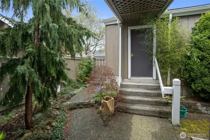 Covered walkway to the two car garage
