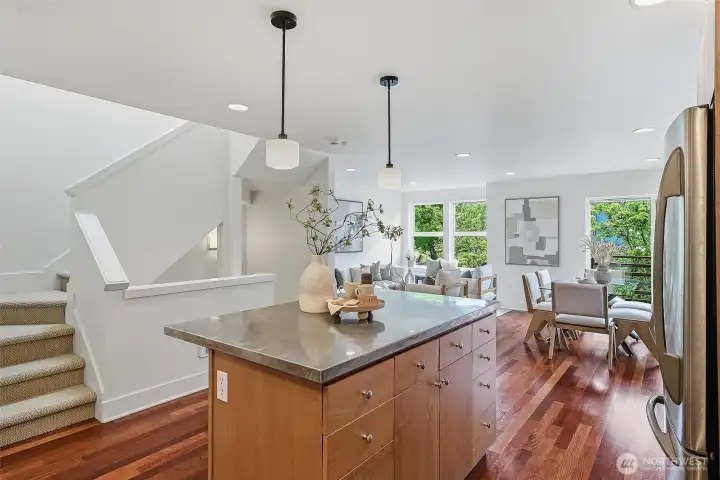 Expansive, open-concept kitchen flows effortlessly into the spacious main living area