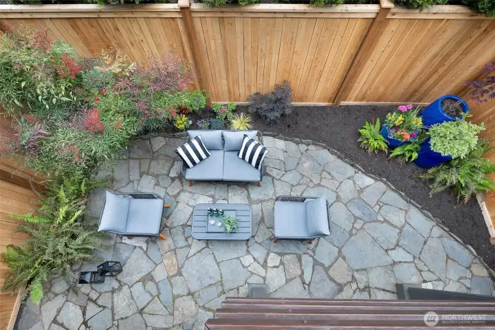 Gorgeous view of the patio and the new cedar fence from upstairs balcony
