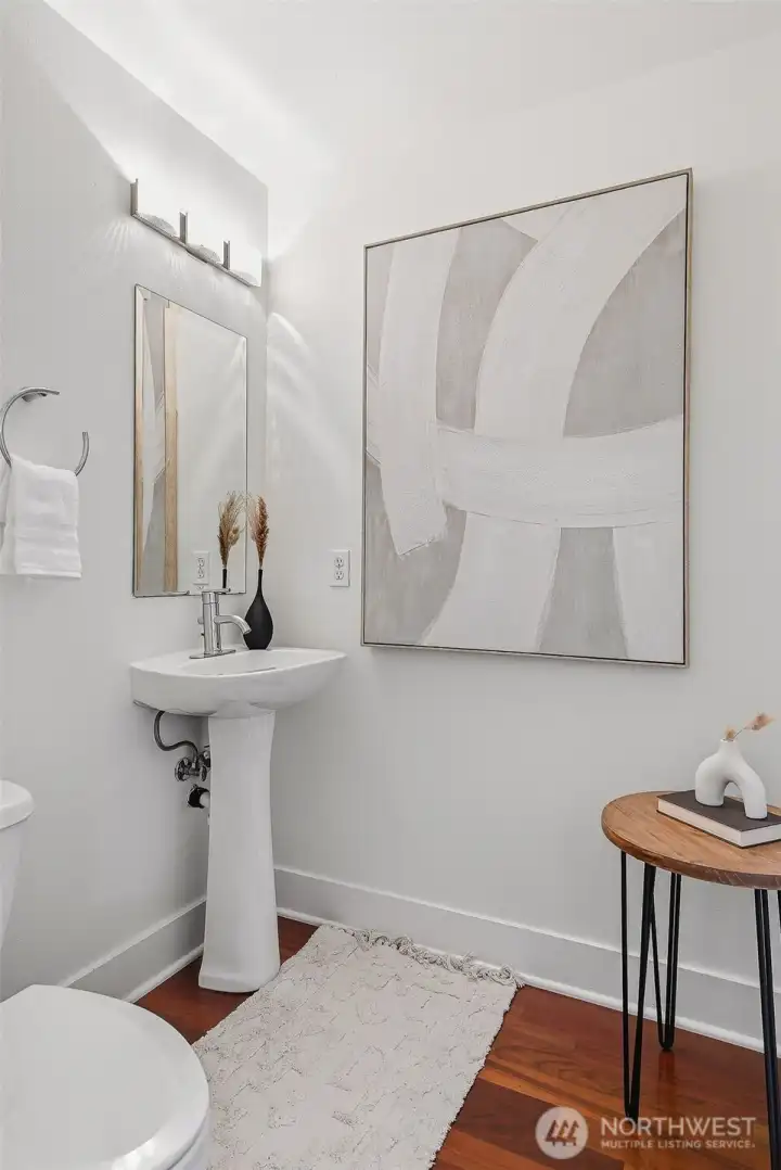 Powder room off of the living room and kitchen