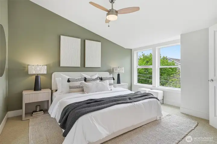 One of two primary bedrooms off 2nd floor, with vaulted ceilings and a spacious en suite