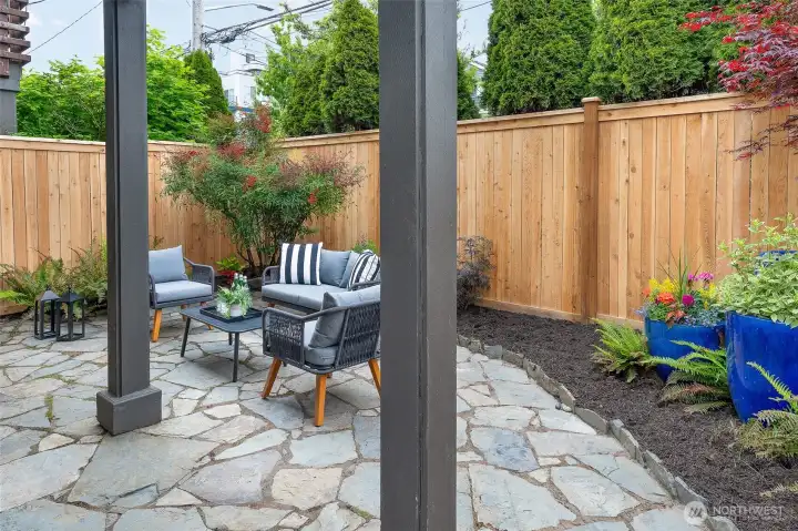 Brand new cedar fence and lush landscaping, make for a cozy retreat.