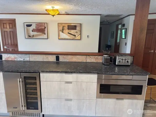 Wine cooler/refrigerator and microwave drawer.