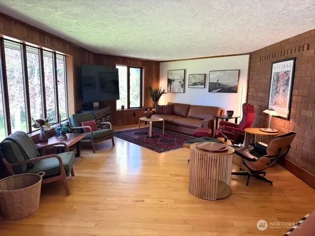Enjoy nature from every window of this open living room