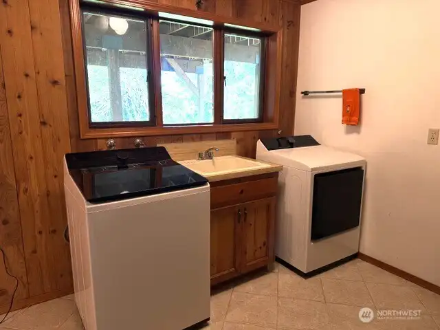 Laundry room with newer appliances