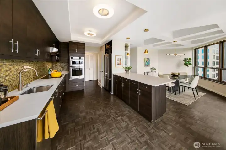 A thoughtfully updated kitchen balances contemporary function with the architectural discipline of the penthouse residence. A thoughtfully updated kitchen balances contemporary function with the architectural discipline of the penthouse residence.
