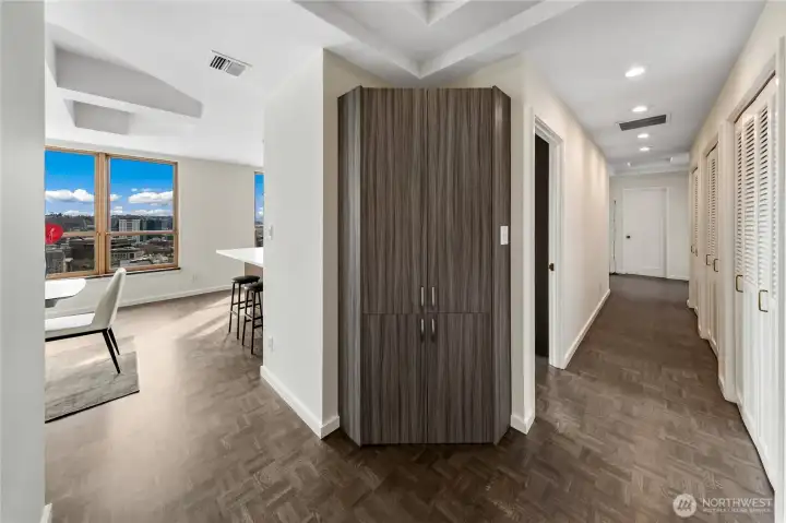 A central hall organizes circulation through the penthouse, separating entertaining spaces from private rooms. A central hall organizes circulation through the penthouse, separating entertaining spaces from private rooms.
