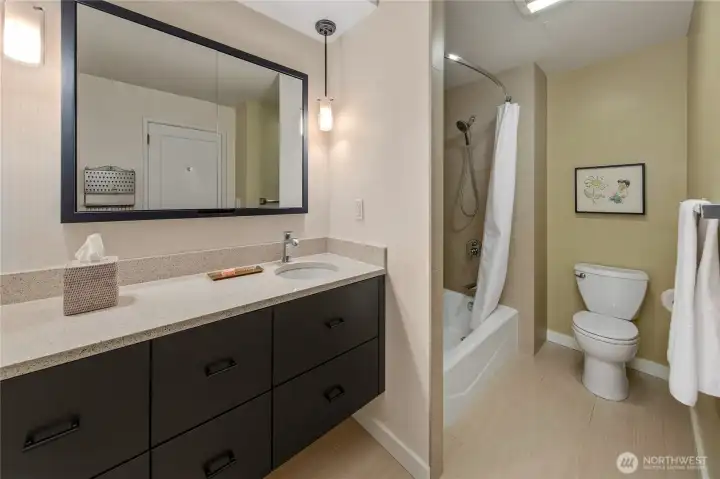 The primary bath pairs generous scale with contemporary finishes and thoughtful storage. The primary bath pairs generous scale with contemporary finishes and thoughtful storage.
