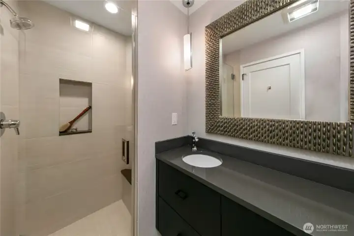 A well appointed secondary bath supports guests and the adjacent bedroom or office. A well appointed secondary bath supports guests and the adjacent bedroom or office.