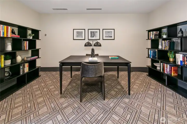 The resident library creates a quiet setting for reading or work within the building. The resident library creates a quiet setting for reading or work within the building.