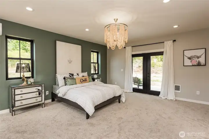 PRIMARY BEDROOM WITH FRENCH DOORS AND PATIO