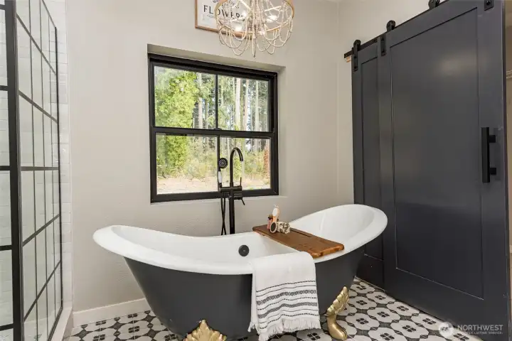 FREESTAND CAST IRON TUB IN PRIMARY BATHROOM