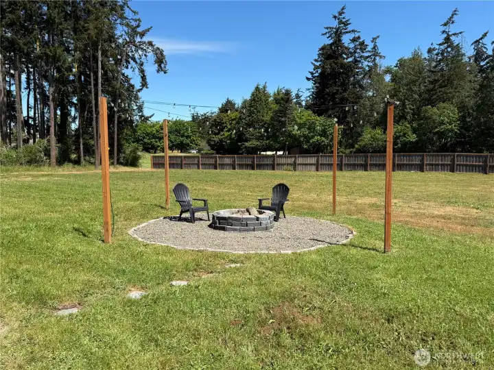 SIDE YARD WITH SITTING AREA AND FIREPIT