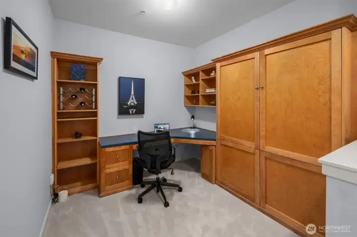 Spacious den with murphy bed to the right of the entry.