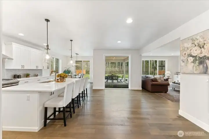 A dramatic oversized window floods the space with natural light, seamlessly bringing the NW beauty of the outdoors inside. The seller added a custom bubbling fountain which adds a soothing, resort-style serenity to the outdoor space.