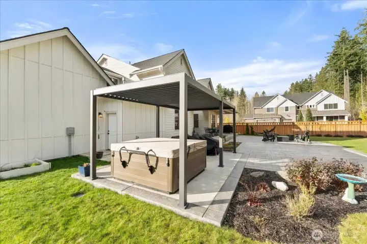 Seller had a thoughtfully designed Hot Spring salt water 7 seat hot tub area installed with a custom louvered pergola, offers a private, spa-like outdoor experience.
