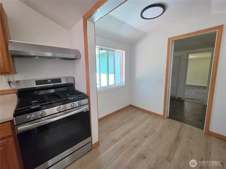 Kitchen with eating nook next to laundry room