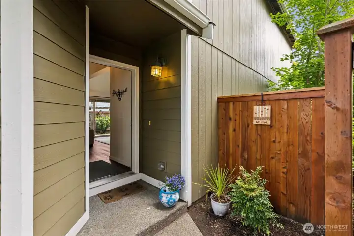 The private, side entrance leads to a soaring, open, interior retreat. Put your favorite seasonal decor here and greet guests with a covered porch. Keyless entry and recent exterior paint in on-trend tones too! The private, side entrance leads to a soaring, open, interior retreat. Put your favorite seasonal decor here and greet guests with a covered porch. Keyless entry and recent exterior paint in on-trend tones too!