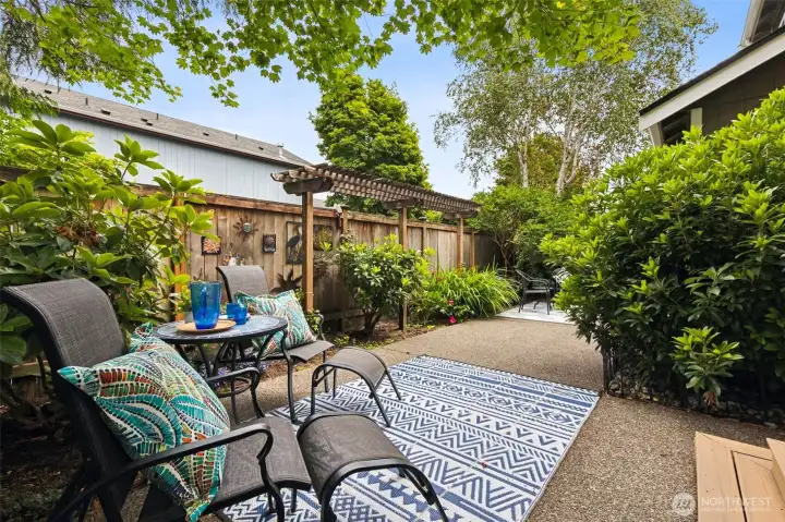 The side, court-yard style yard/patio extends the full side of the house with the alley access lane on the other side of the fence for ultimate privacy. The classic pergola waits for your summer flower baskets or patio lights. The side, court-yard style yard/patio extends the full side of the house with the alley access lane on the other side of the fence for ultimate privacy. The classic pergola waits for your summer flower baskets or patio lights.