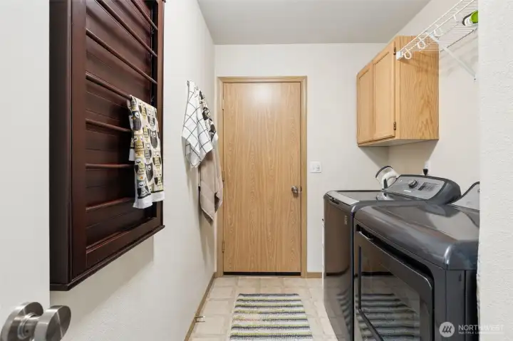 The newer washer/dryer are included with the home, along with the pull-out drying rack. Not seen is a large recess ready for a future laundry sink or storage. Unload your outdoor wardrobe from the car to the washer! The newer washer/dryer are included with the home, along with the pull-out drying rack. Not seen is a large recess ready for a future laundry sink or storage. Unload your outdoor wardrobe from the car to the washer!