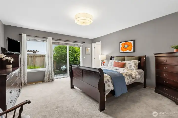 The extra large primary sleeping suite offers space for many sleeping arrangements. Imagine your retreat sofa or recliner near the pretty garden window. The extra large primary sleeping suite offers space for many sleeping arrangements. Imagine your retreat sofa or recliner near the pretty garden window.